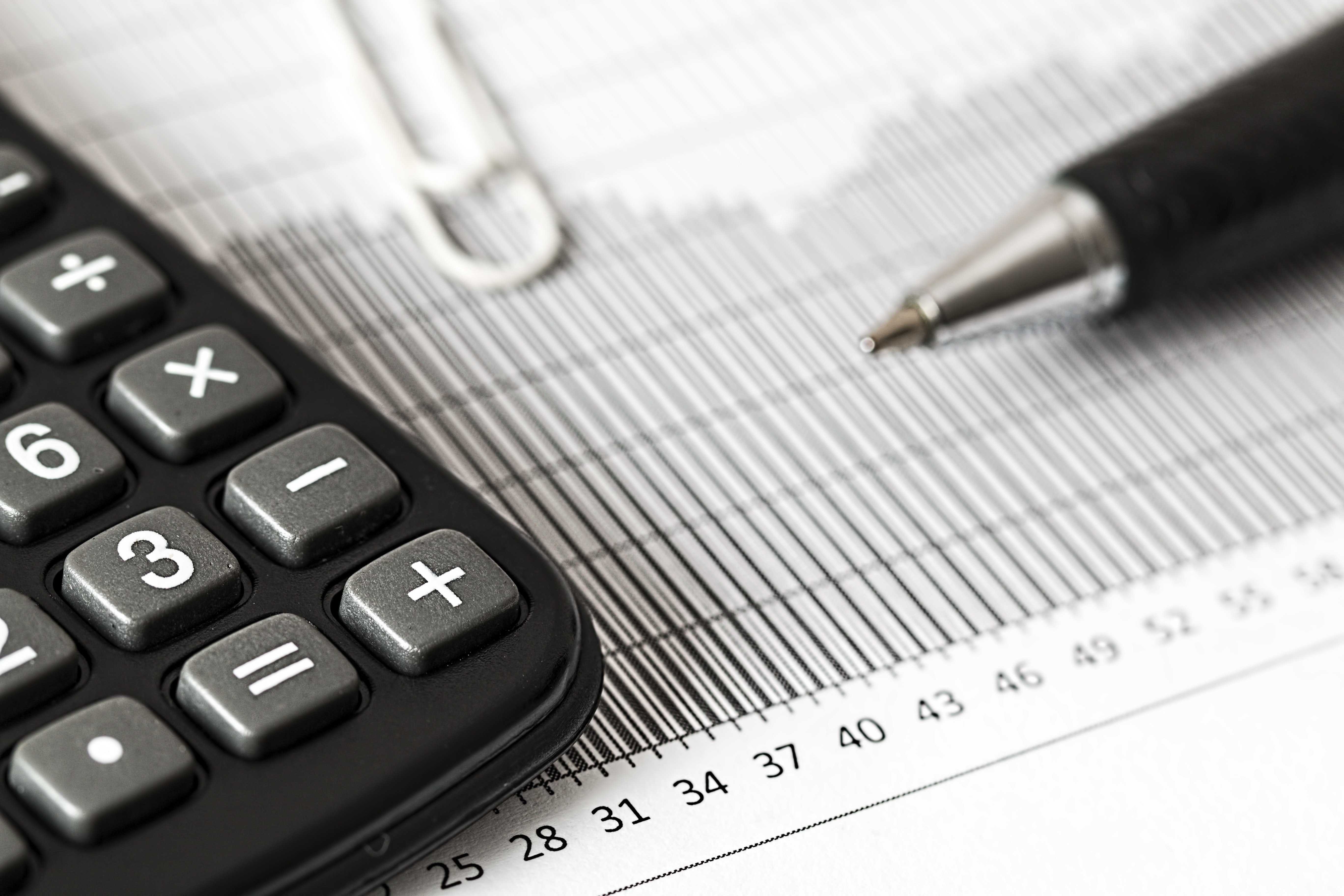 calculator and pen lying statistic