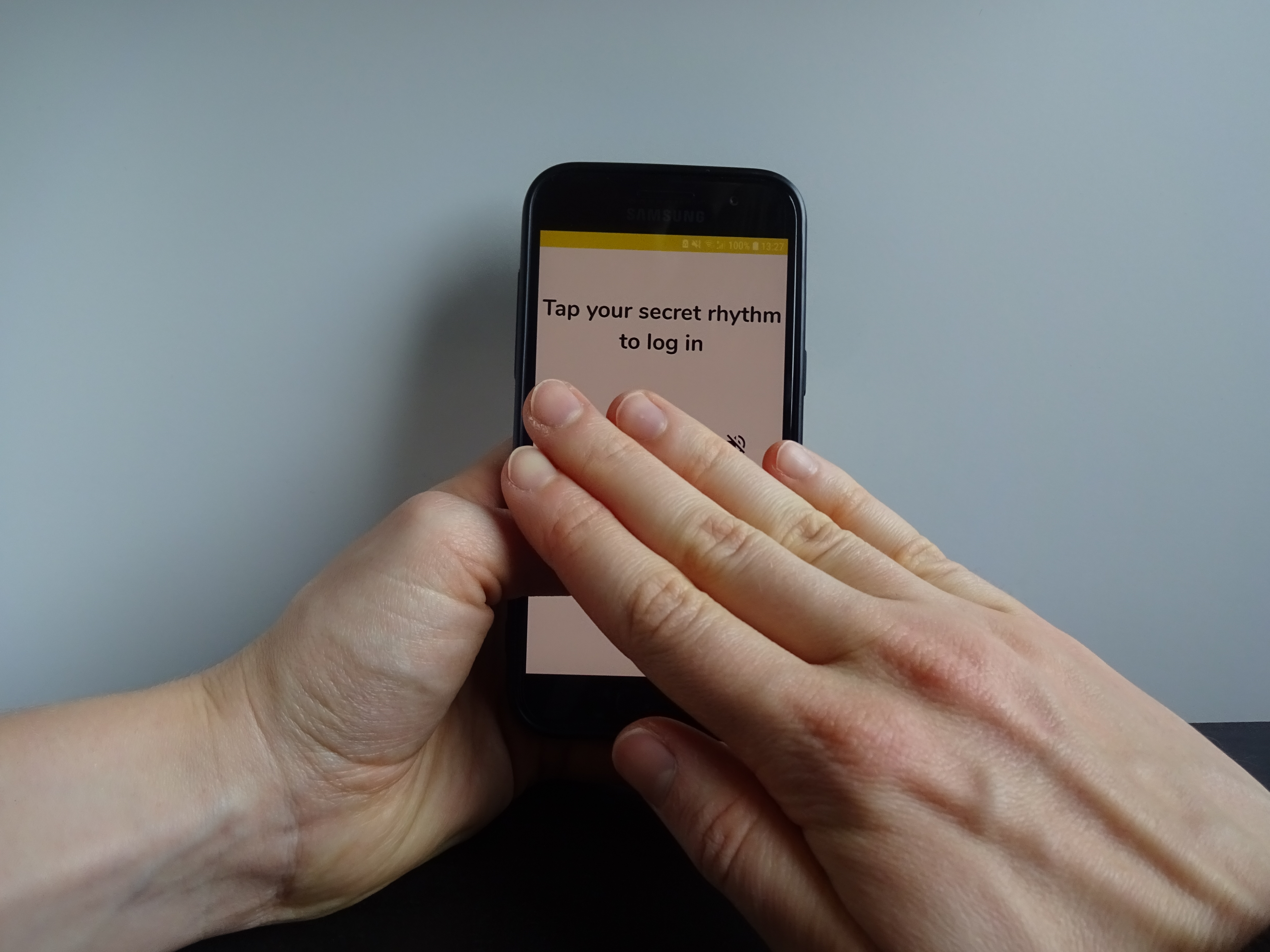 hand covering phone during password input